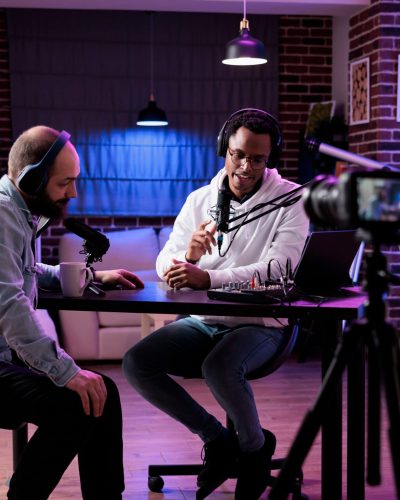 Online,Vlogger,Filming,Podcast,Episode,With,Man,In,Studio,,Using